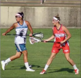  ?? SUBMITTED PHOTO — ANDREW BACHMAN ?? Pottstown High School alum Kasey Mock, right, is pictured during a recent Boston Storm women’s lacrosse game.