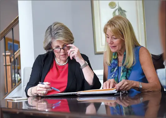  ?? Baltimore Sun/TNS/LLOYD FOX ?? Bonnie Bird (right) worked with financial planner Kathy Armstrong to rebuild her finances after a divorce. The new plan included working longer and moving from Maryland to North Carolina, where the cost of living is lower.