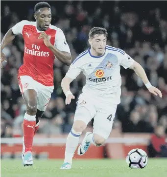  ??  ?? Lynden Gooch gets away from Arsenal’s Danny Welbeck. Picture by Frank Reid.