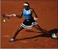  ?? JULIEN DE ROSA — AFP VIA GETTY IMAGES ?? Coco Gauff earned a fourth-round win over Anna Karolina Schmiedlov­a on Monday at the French Open.