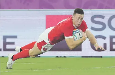  ?? Picture: Getty Images ?? TREBLE. Wales wing Josh Adams scored a hat-trick in their bruising World Cup win over Fiji at Oita Stadium yesterday.