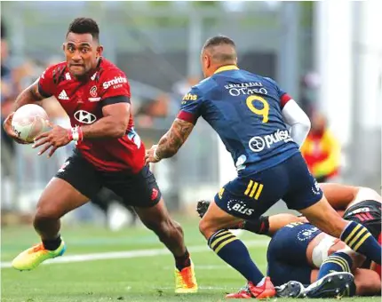  ?? Feedback: leonec@fijisun.com.fj Photo: Super Rugby Aotearoa ?? Sevu Reece of the Crusaders (with ball) takes on Highlander­s halfback Aaron Smith during the Super Rugby Aotearoa opener at the Forsyth Barr Stadium in Dunedin on February 27, 2021.