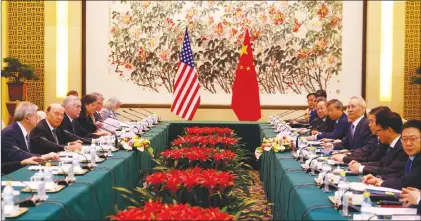  ?? AP PHOTO ?? U.S. Commerce Secretary Wilbur Ross, second from left, and Chinese Vice Premier Liu He, fourth right, attend a meeting at the Diaoyutai State Guesthouse in Beijing.