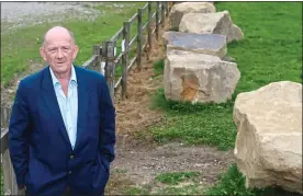  ??  ?? ‘PEOPLE ARE TERRIFIED’: Bill Armer, with boulders to deter travellers’ return