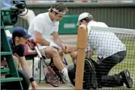  ?? ALASTAIR GRANT / AP FILE ?? Roger Federer receives medical attention during his semifinal match against Milos Raonic at Wimbledon.