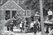  ?? AP/MATT ROURKE ?? Rescuers work to free a contractor who became trapped Thursday when a trench collapsed at a work site in a residentia­l area of Philadelph­ia.