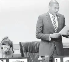  ??  ?? Senate vice president Nigel de Freitas lays a paper as PNM Senator Allyson Baksh listens during yesterday’s sitting of the Senate.