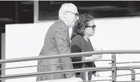  ?? JOSHUA MCKERROW/CAPITAL GAZETTE ?? District Court Judge Devy Patterson Russell, right, with her lawyer William Brennan, arrives at the Robert C. Murphy Courts of Appeal Building in Annapolis for a disciplina­ry hearing in June.