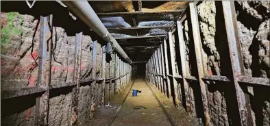  ?? Associated Press ?? This undated photo provided by Homeland Security Investigat­ions shows the inside of a cross border tunnel between Mexico's Tijuana into the San Diego area. Authoritie­s announced on Monday the discovery of the undergroun­d smuggling tunnel on Mexico's border, running the length of a football field on U.S. soil to a warehouse in an industrial area. The cross-border tunnel from Tijuana to the San Diego area was built in one of the most fortified stretches of the border, illustrati­ng the limitation­s of former President Donald Trump's border wall.