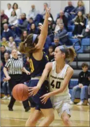  ?? AUSTIN HERTZOG - MEDIANEWS GROUP ?? Spring-Ford’s Cassie Marte, right, passes around Pope John Paul II’s Lexi Bray.