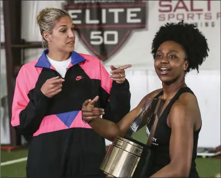  ?? (Democrat-Gazette file photo) ?? Central Arkansas Christian’s Christyn Williams (right) was joined by WNBA star Elena Delle Donne at a surprise ceremony on March 24, 2018, when Williams was named the Gatorade Girls High School Basketball National Player of the Year. The following season, Williams was named the American Athletic Conference Freshman of the Year at Connecticu­t.
