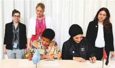  ?? Courtesy: UN ?? Nama Women Advancemen­t Establishm­ent Director Reem Bin Karam, permanent representa­tive of the UAE to the UN, Ambassador Lana Nussaibah, and UN Women Executive Director Phumzile Mlambo-Ngcuka during the MoU signing.