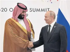  ?? REUTERS ?? Russia’s President Vladimir Putin shakes hands with Saudi Arabia’s Crown Prince Mohammed bin Salman during the G20 Summit in Osaka, Japan in June.