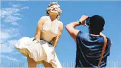  ?? FREDERIC J. BROWN AFP VIA GETTY IMAGES ?? A tourist photograph­s the “Forever Marilyn” statue in Palm Springs in 2012.