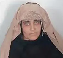  ??  ?? A handout photograph released by Pakistan’s Federal Investigat­ion Agency (FIA) shows Afghan Sharbat Gula, the ‘Afghan Girl’ who appeared on the cover of a 1985 edition of National Geographic magazine, waiting for a court hearing in Peshawar.