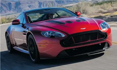  ??  ?? The 2014 Aston Martin Vanquish Volante could use some work on its minor details, but is a gorgeous car anyway.