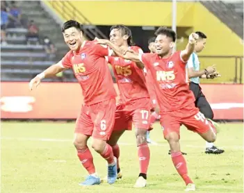  ??  ?? Park Tae Su is joined by Amri Yahya and Saddil Ramdani celebratin­g Sabah’s third goal, courtesy of the South Korean defender in the 4-0 win over UiTM FC in Likas on Saturday night.