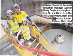  ?? ?? Hydro Tasmania Regional Production manager (South) Marty Doyle and daughters Kirra, 12, and Darci, 8, at the Meadowbank Dam and Power Station. Picture: Chris Kidd