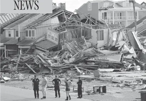  ?? GERALD HERBERT / THE ASSOCIATED PRESS ?? Rescue personnel perform a search operation in the aftermath of hurricane Michael in Mexico Beach, Fla., on Thursday.