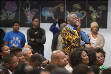  ?? Staff photo by Evan Lewis ?? The crowd listens as the Rev. Dr. Cory Brown talks about the need for a more-involved black community Monday during the keynote presentati­on of the Greater Texarkana Branch of the NAACP at Dunbar Elementary in Texarkana, Texas.