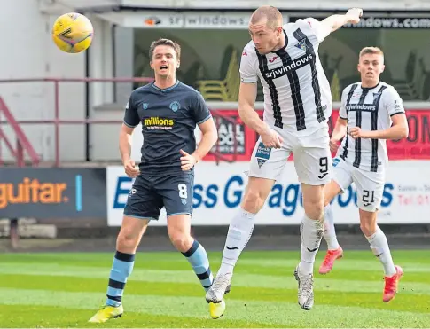  ??  ?? GOAL: Former Dundee man Craig Wighton heads home what turned out to be the Pars’ winner against Morton.