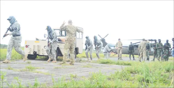  ??  ?? Members of the Dominican Republic Special Operations Force participat­ing in a drill yesterday