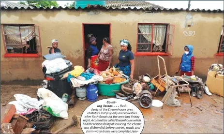  ?? Picture: Tinai Nyadzayo ?? Counting losses . . . Residents of the Dreamhouse area of Mutare lost property and valuables after flash floods hit the area last Friday night. A committee called Dreamhouse which had the responsibi­lity of servicing the scheme was disbanded before sewers, roads and storm-water drains were completed, leaving residents vulnerable to floods. —