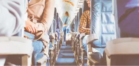  ?? Photo / Getty Images ?? Smile and politely greet the passengers in the same row as you as you take your seats.