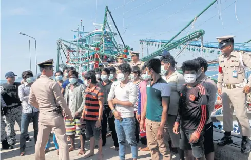  ??  ?? Foreign crew members who were working illegally on a fishing vessel were arrested by the Command Centre for Combatting Illegal Fishing while it was conducting a drill in Chon Buri last December, as shown in this file photo.