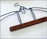  ?? CAROLYN KASTER — THE ASSOCIATED PRESS ?? A coat hanger belonging to Fritz Steckelmac­her from the time of the Holocaust is seen on display at the U.S. Holocaust Memorial Museum’s David and Fela Shapell Family Collection­s, Conservati­on and Research Center in Bowie, Md., Monday. The Shapell...