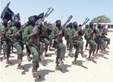  ?? FARAH ABDI WARSAMEH, AP ?? Fighters train south of Mogadishu as militant groups expand their operations in sub-Saharan Africa.