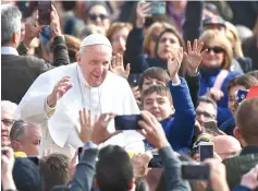  ??  ?? Pope Francis waves to worshipers upon his arrival for the weekly general audience at St. Peter’s square in the Vatican. — AFP photo