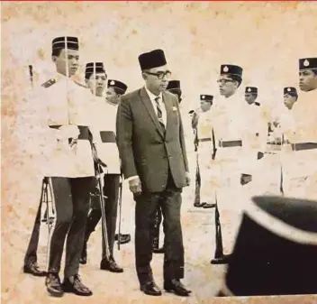  ??  ?? A young pilot officer (now second lieutenant) Goh Seng Toh (left) accompanyi­ng then deputy prime minister and defence minister Tun Abdul Razak Hussein during the passing-out parade at the RMAF flying school in Alor Star, Kedah, in 1966.