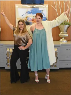  ?? STACI VANDAGRIFF/TRILAKES EDITION ?? Striking a “Staying Alive” pose at the Benton Event Center are Heidi Freeman, left, and Hannah Harney, co-chairs of the Junior Auxiliary of Saline County’s Studio 501 fundraiser set for 7-11 p.m. Saturday at the center. The event has a ‘70s cocktail-attire theme. Tickets are $50 per person, and all proceeds will go toward JA’s service projects, which focus on children in the county.