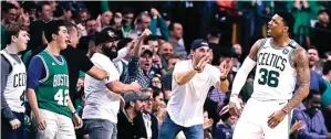  ?? CHARLES KRUPA/AP PHOTO ?? SELAMAT: Guard Boston Celtics Marcus Smart merayakan kemenangan timnya atas Milwaukee Bucks pada game ketujuh ronde pertama playoff di TD Garden, Boston, kemarin.