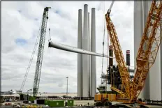  ?? SUZIE HOWELL — NEW YORK TIMES FILE ?? A ship receiving a turbine blade made by Siemens Gamesa Renewable Energy, which a reported a $940 million loss this year, in Hull, England, on Sept. 10, 2019.