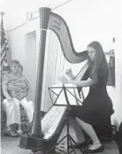  ?? BRITTANY BRITTO/BALTIMORE SUN ?? Vivian Stewart, 16, plays music by Eliza Ridgely, owner of the 200-year-old harp that was celebrated Saturday at the Hampton National Historic Site.