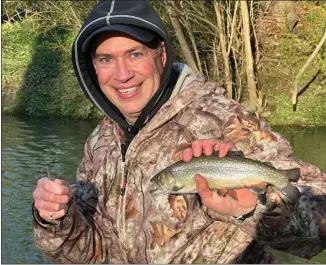  ?? SUBMITED PHOTO ?? Opening day fisherman Scott Allen of West Chester shows off a brook trout he caught and released Saturday morning.