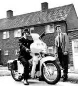  ??  ?? This was one of the machines from the Metropolit­an Police’s first big Velocette LE order of 1957. As this photo illustrate­s, the force was keen to point out that putting constables on motorcycle­s did not mean they would lose touch with the public.