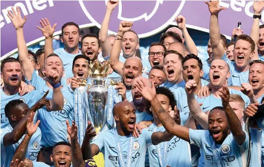  ?? AFP ?? Manchester City, managed by Spaniard Pep Guardiola, won the English Premier League last season at a canter.