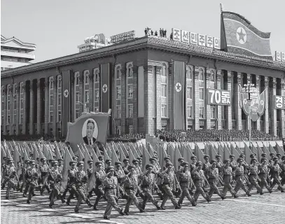  ?? REUTERS ?? Soldiers march on Sept. 9, 2018, Pyongyang, North Korea with the portrait of North Korean founder Kim Il Sung during a military parade marking the 70th anniversar­y of country’s foundation.