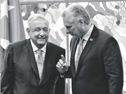  ?? YAMIL LAGE/POOL PHOTO VIA AP ?? Cuban president Miguel Diaz Canel and his Mexican counterpar­t Andrés Manuel López Obrador chat after signing bilateral agreements at Revolution Palace in Havana, Cuba, on Sunday.