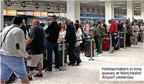  ?? ?? Holidaymak­ers in long queues at Manchester Airport yesterday