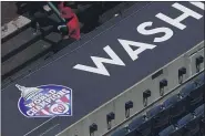  ?? NICK WASS — THE ASSOCIATED PRESS ?? A 2019 World Series champions logo displayed is seen on the top of the dugout during a Nationals workout July 22.