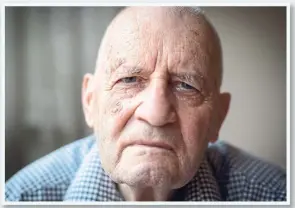  ??  ?? Dennis Madigan, now 87, suffered horrific burns as a teenager working at a gas station. His initial claim for workers’ compensati­on, filed by his father, was rejected in 1950.