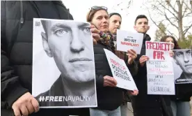  ?? Photograph: Paul Zinken/AP ?? Alexei Navalny supporters demonstrat­e outside the home of the Russian ambassador in Berlin.