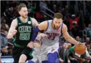  ?? PAUL SANCYA — THE ASSOCIATED PRESS ?? Detroit Pistons forward Blake Griffin (23) protects the ball from Boston Celtics forward Gordon Hayward (20) in the second half of an NBA basketball game in Detroit on Saturday.