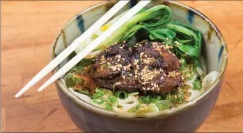  ?? ALEX CATERSON, THE SPLINTER GROUP ?? All noodles are handmade at Rose’s Meat Market and Sweet Shop in Durham, N.C., where guests can enjoy dishes like this soy caramel pork and bok choy.