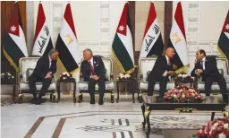  ?? (Khalid al-Mousily/Reuters) ?? IRAQI PRESIDENT Barham Salih (left), Jordanian King Abdullah II, Iraqi Prime Minister Mustafa al-Kadhimi and Egyptian President Abdel Fattah al-Sisi converse during a summit in Baghdad on Sunday.