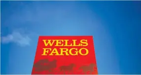  ?? REUTERS ?? CONSUMERS opening checking and credit card accounts with Wells Fargo & Co. continued to drop last month.
